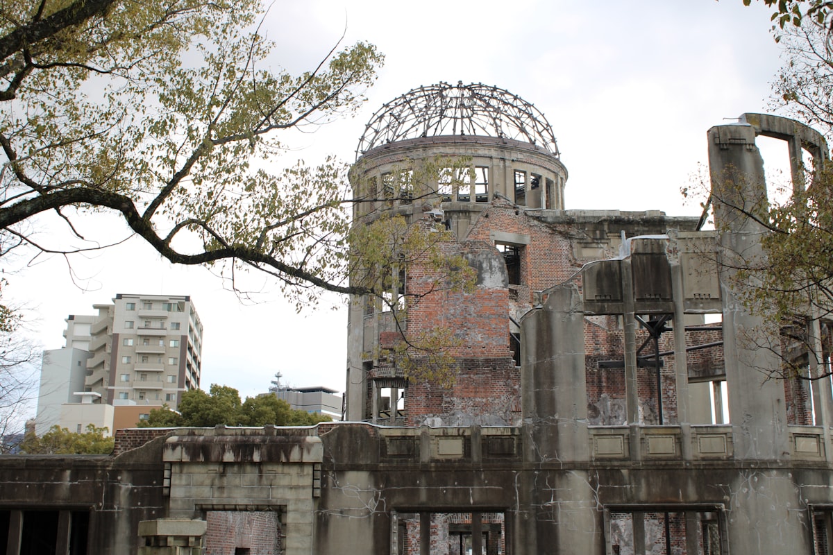 Ruined dome building with modern buildings in background