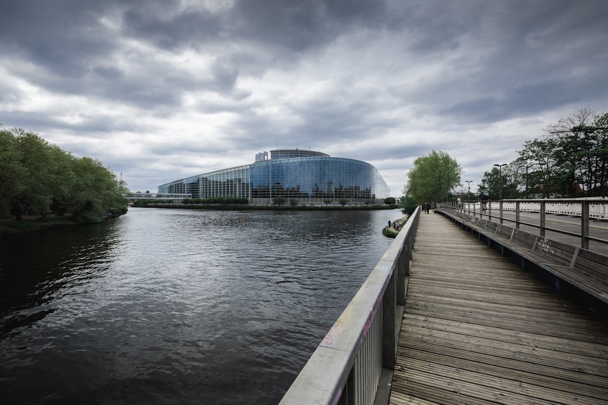a wooden dock leading to a building