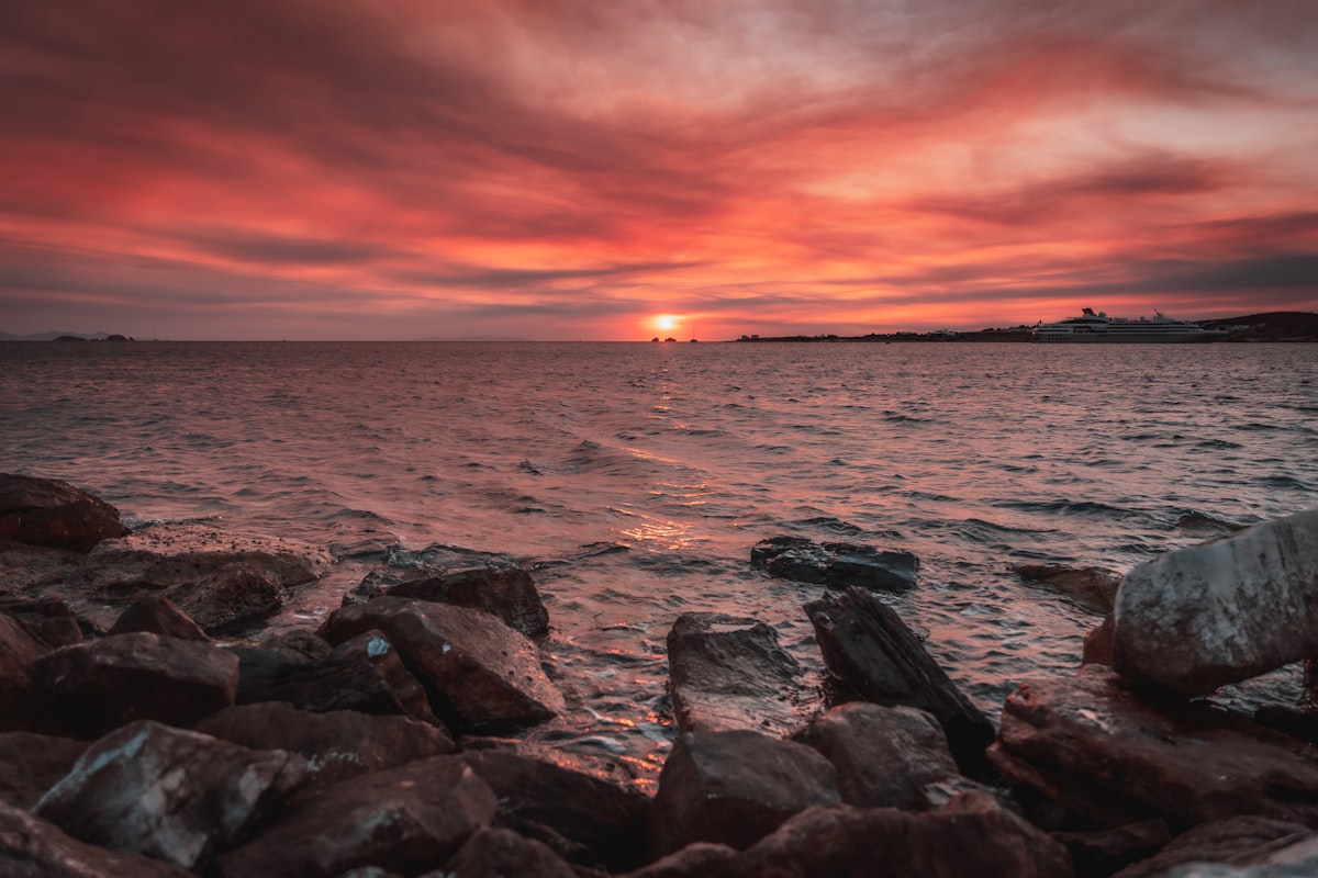 gray rocky shore during sunset