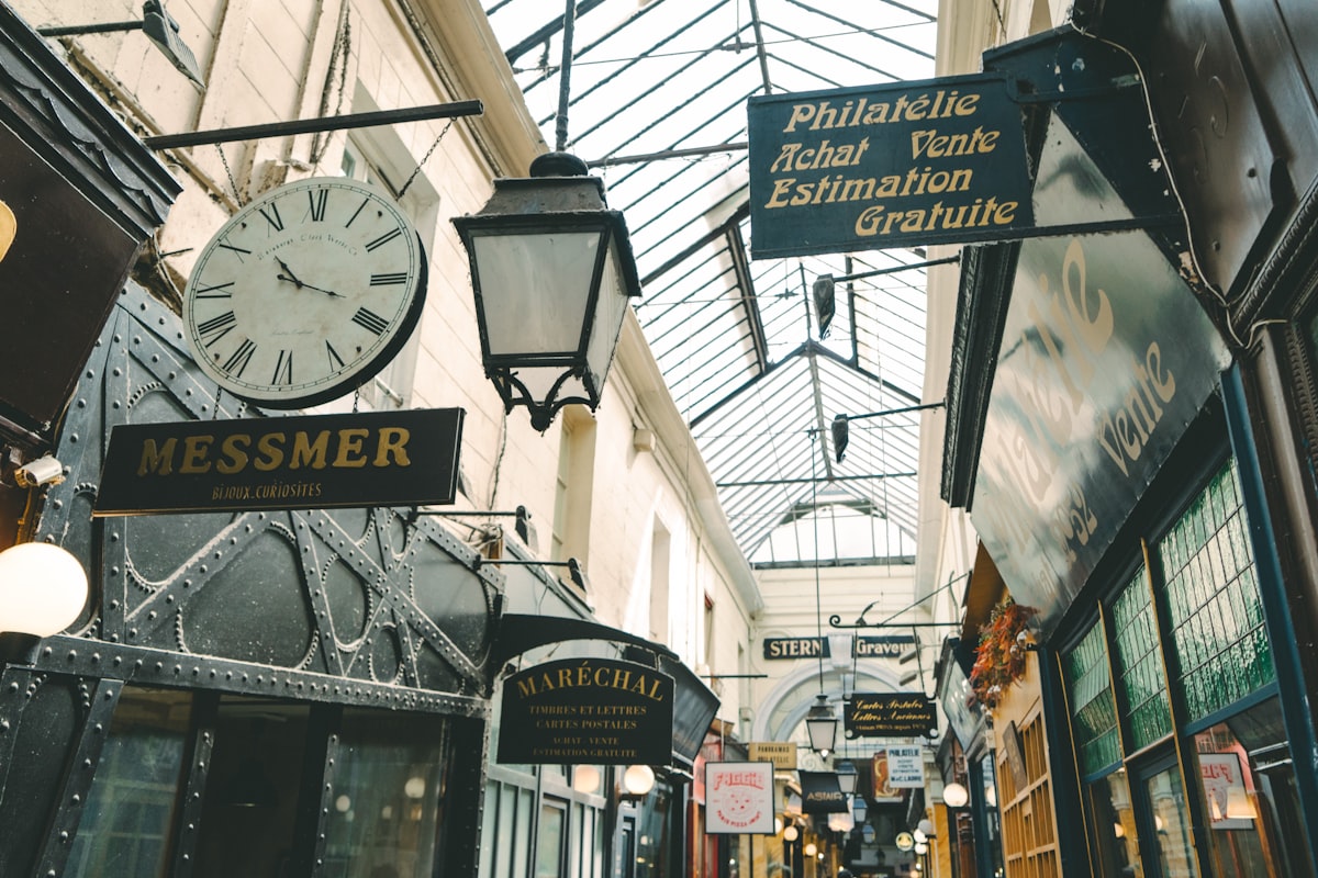 a clock hanging from the side of a building