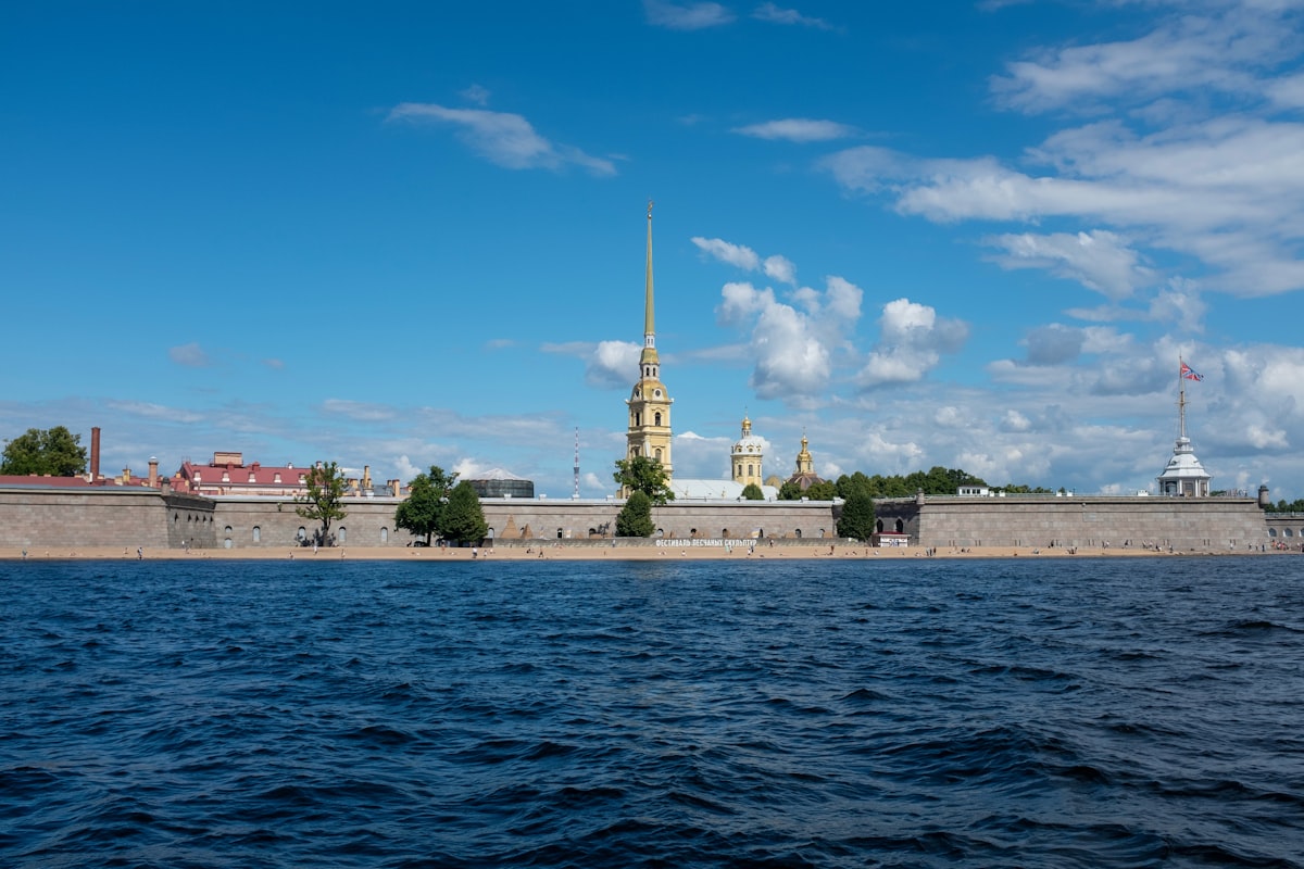 a large body of water with buildings in the background