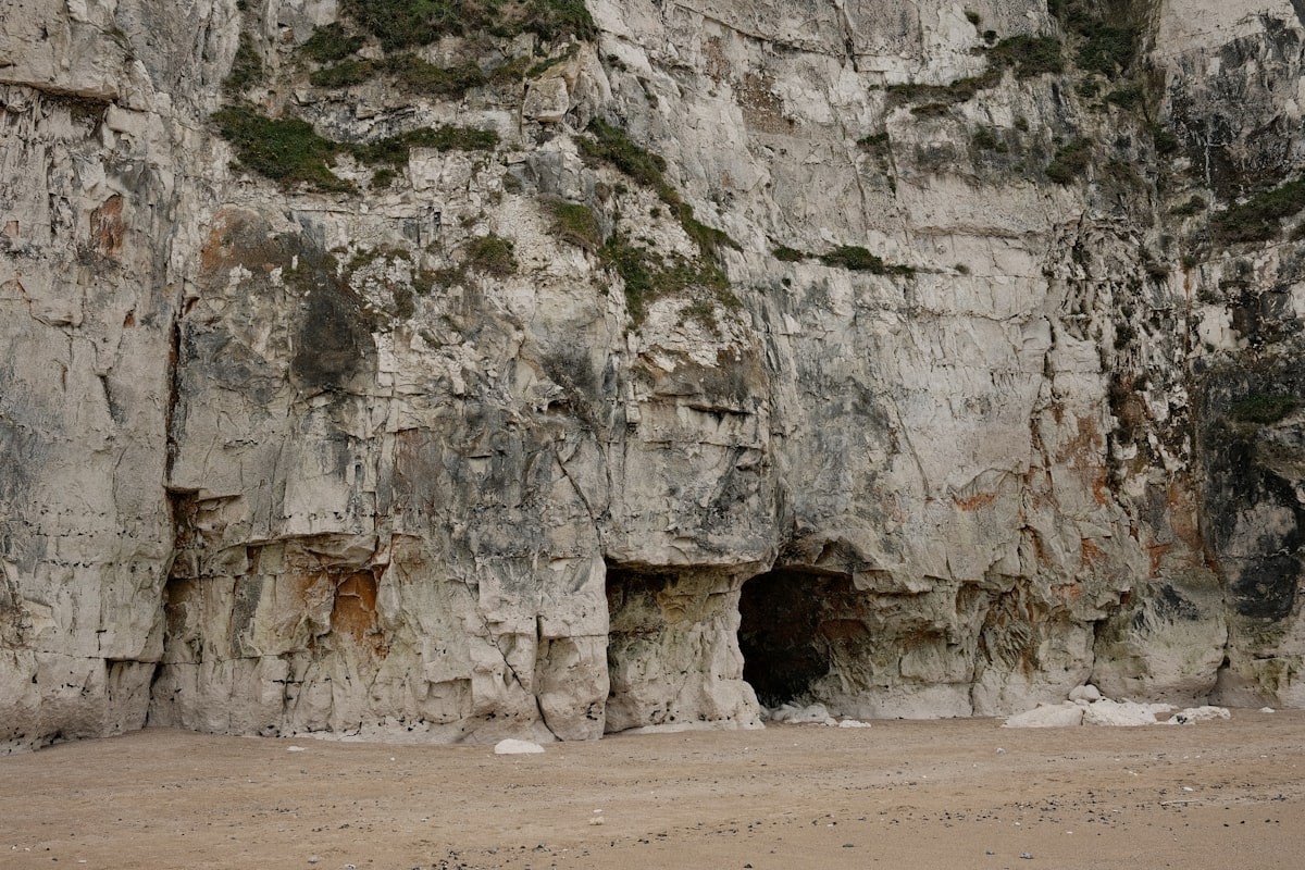 Cave entrance in a rocky cliff face