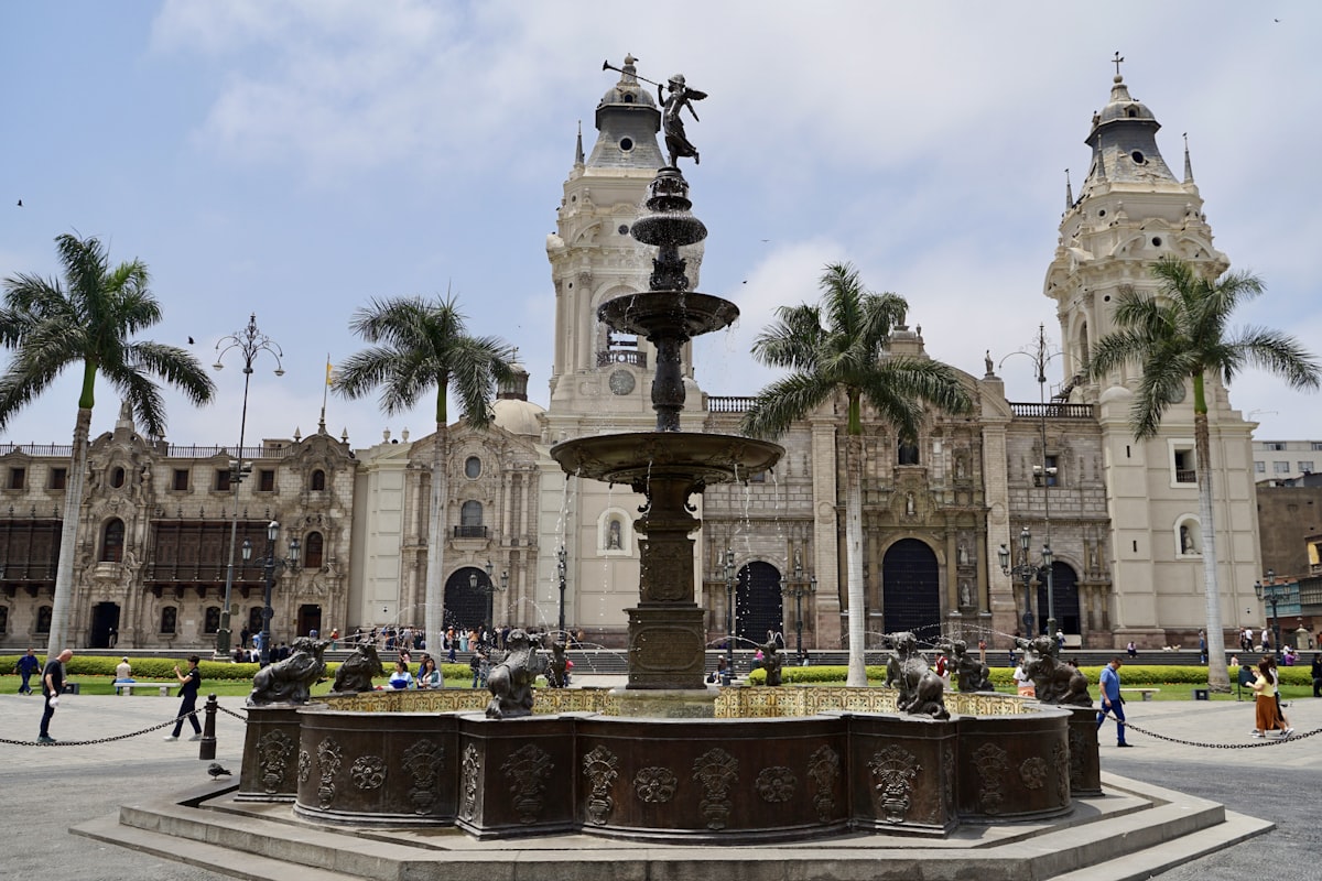 a large building with a fountain in front of it