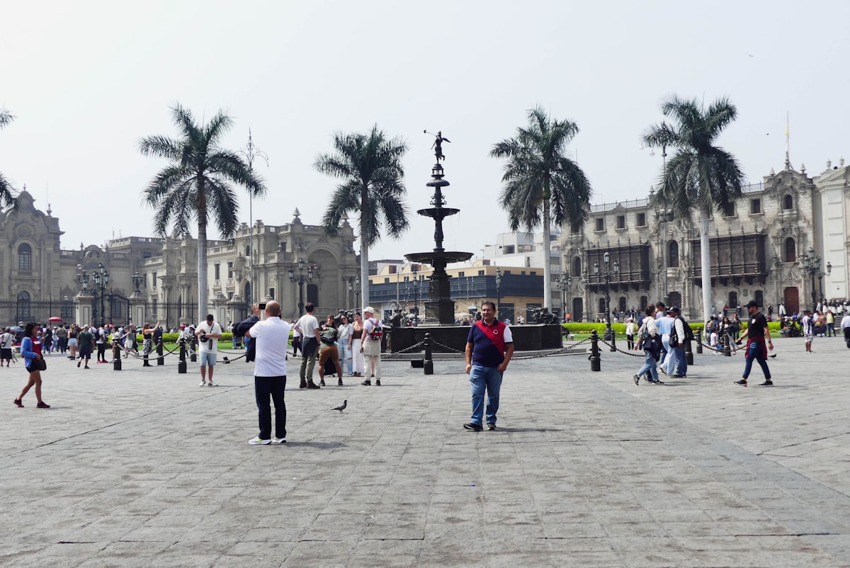 a group of people standing around in a courtyard