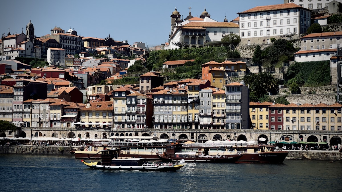 a group of boats floating on top of a body of water