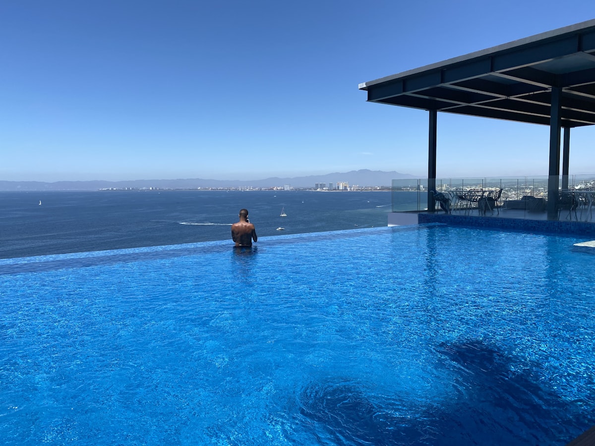 a person sitting in a large swimming pool