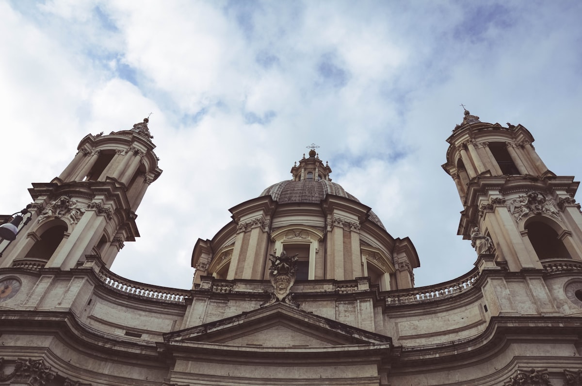 a church with a clock at the top of a building