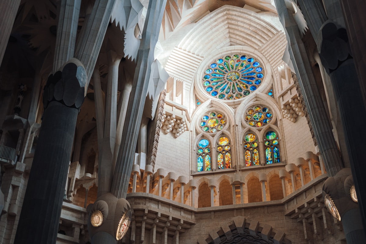 The inside of a cathedral with stained glass windows
