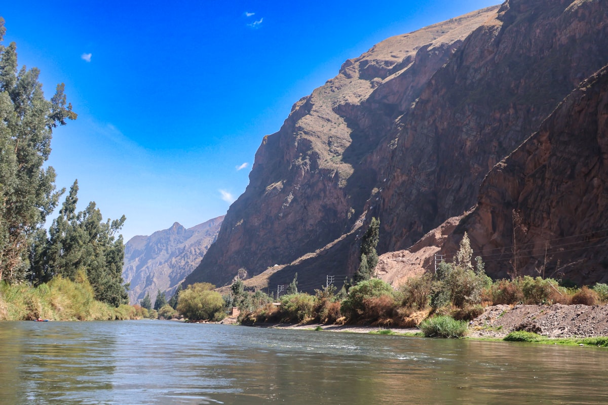 A view of a river with mountains in the background