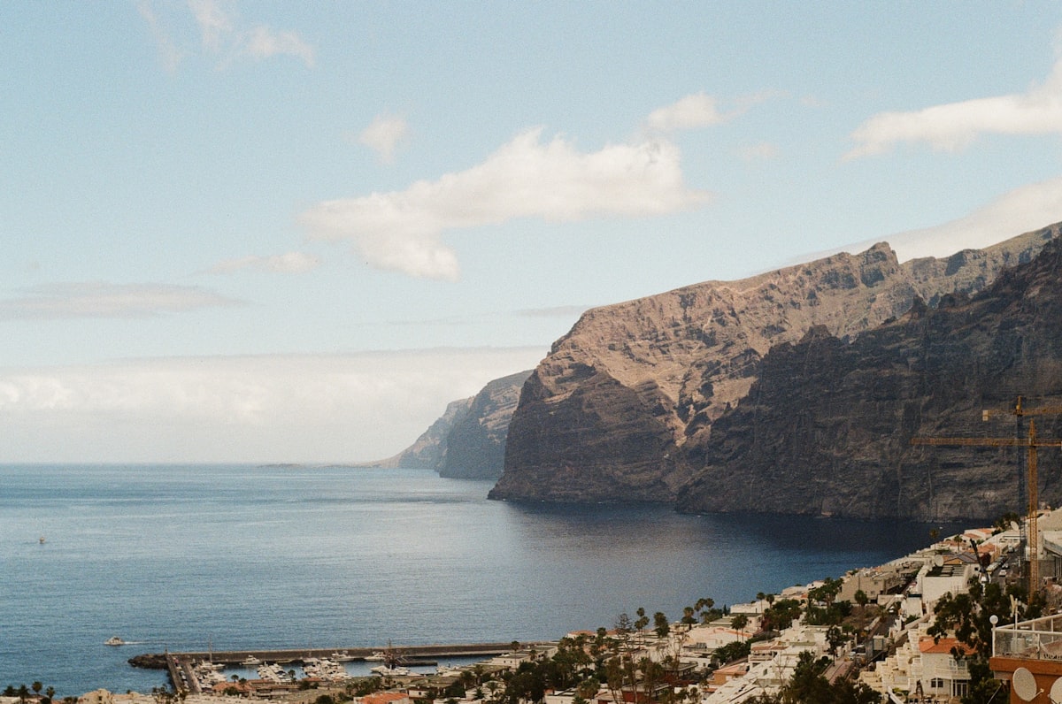 A view of the ocean and mountains from a hill