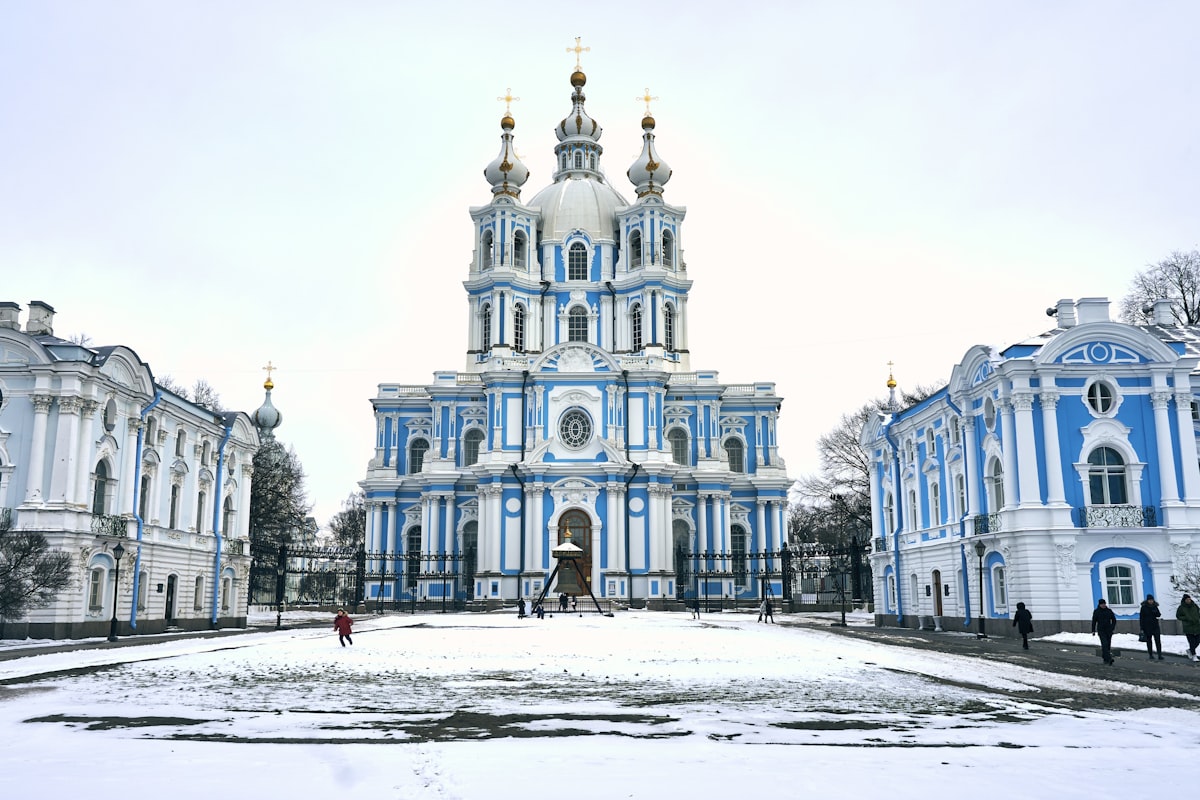 a blue and white building with a clock tower