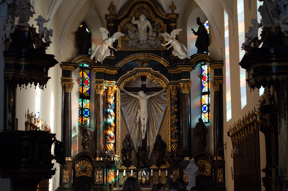 a church with stained glass windows and a crucifix