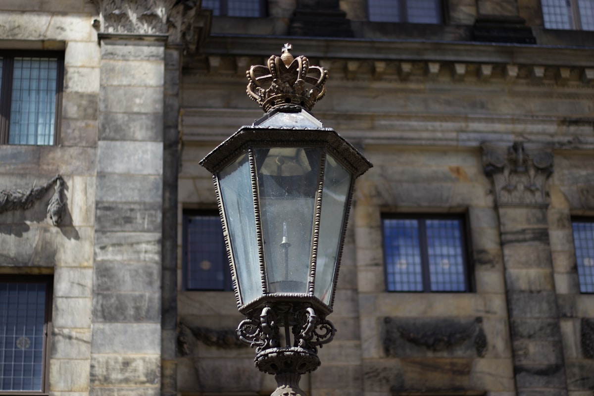 a street light in front of a large building