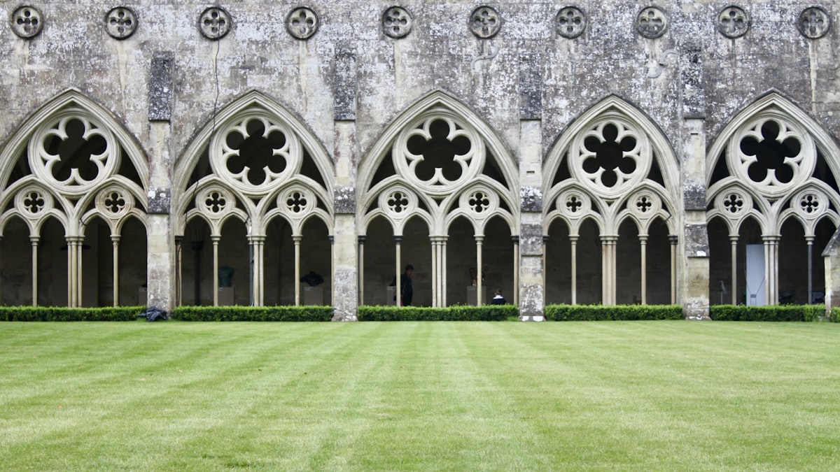 a large building with a lawn in front of it