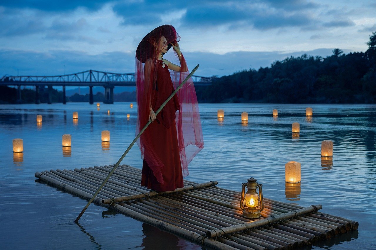 vietnamese girl, asian woman, oil lamp, river, bamboo raft, evening, blue color, paper lantern, floating lantern, rowing raft