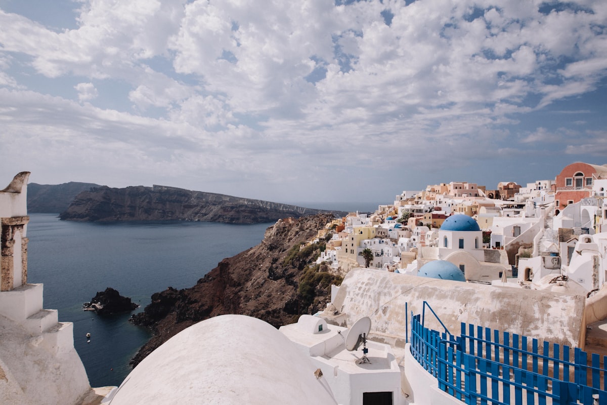 A view of a blue and white building and a body of water