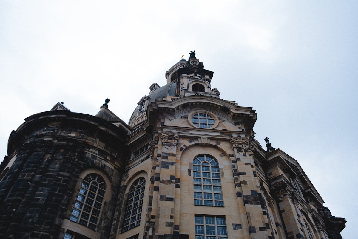 A grand, old church against a cloudy sky.