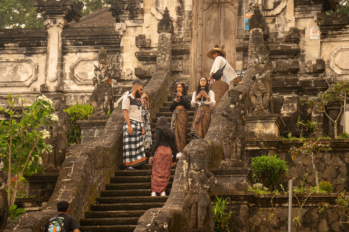 A group of people walking up a set of stairs