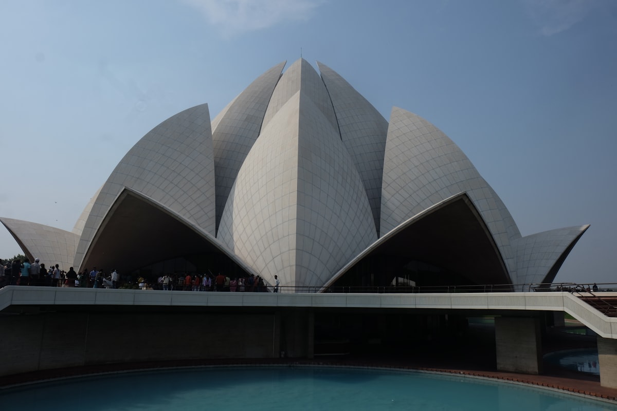 white concrete building near swimming pool during daytime
