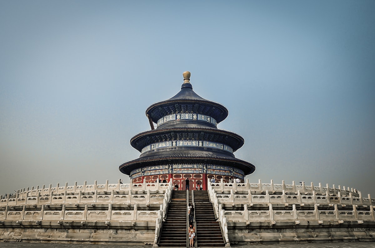 blue and white concrete building under blue sky during daytime