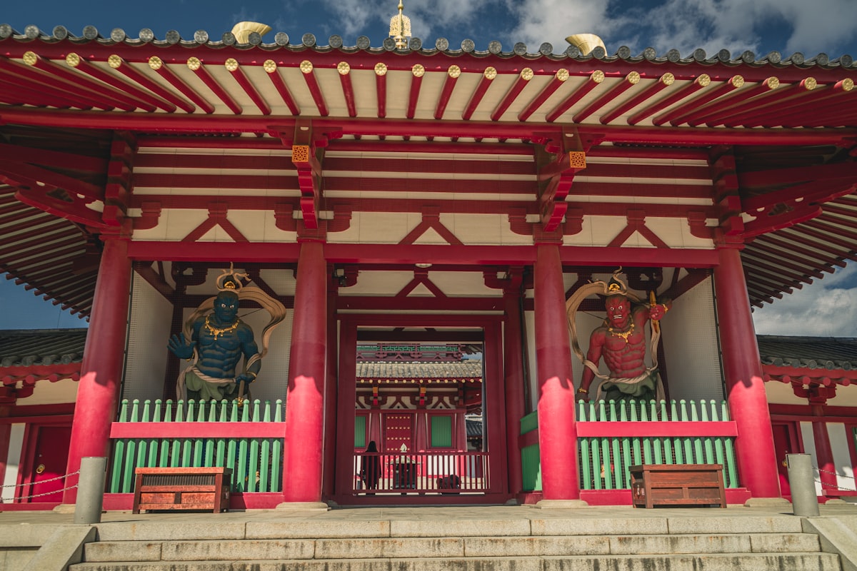 Traditional japanese temple entrance with guardian statues.