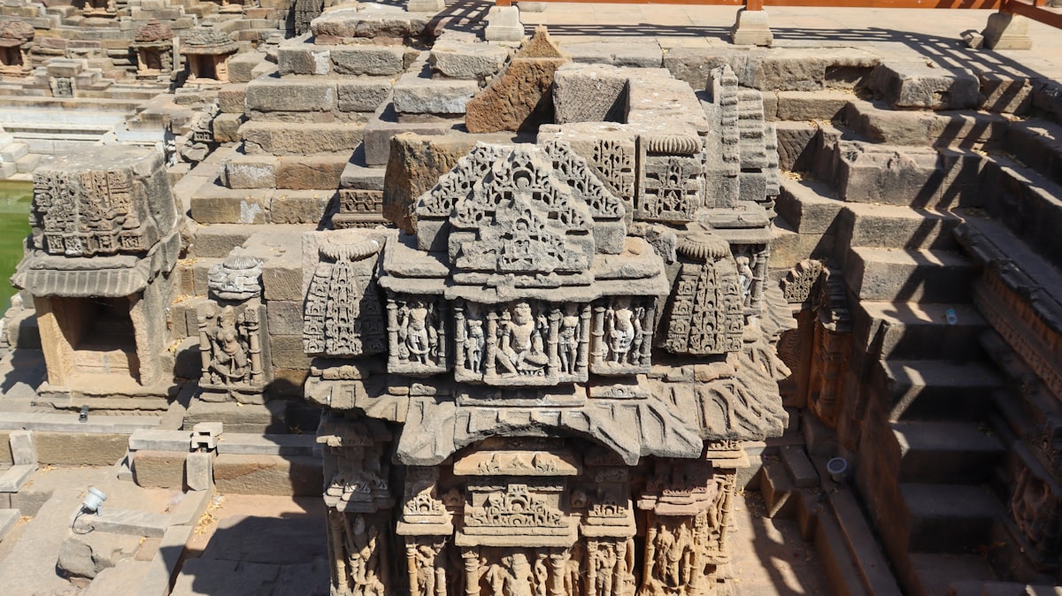 Detailed stone carvings on ancient indian stepwell.