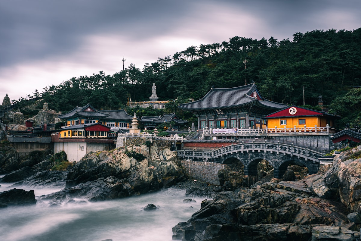 A beautiful temple stands by the rocky coast.