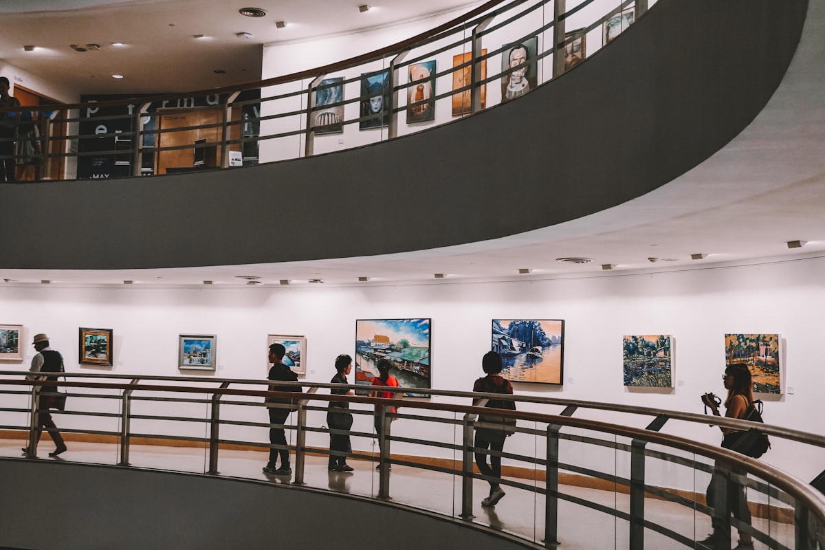 people walking on white concrete building