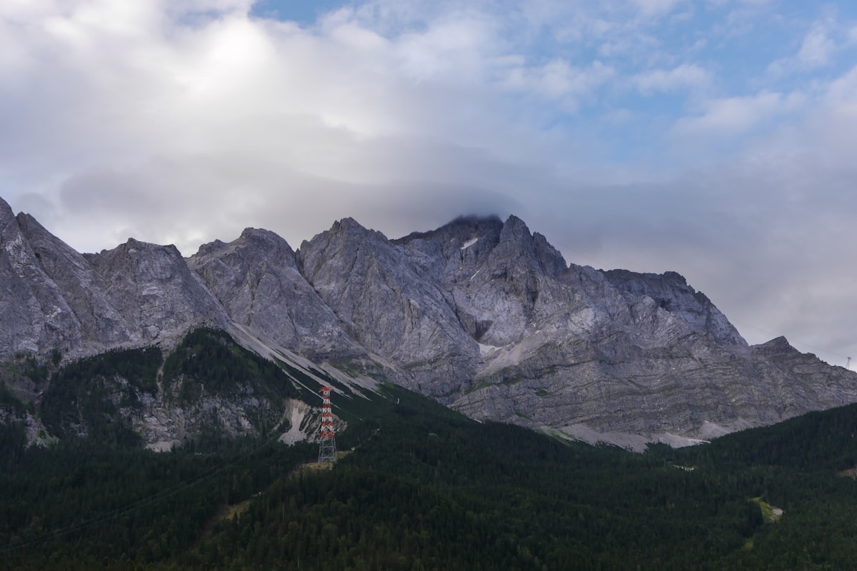 gray rocky mountain under white cloudy sky during daytime