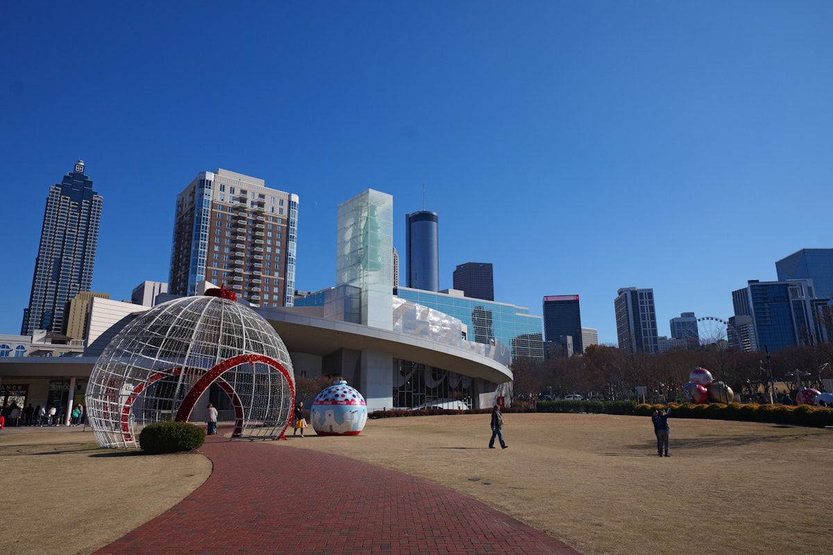 A person is walking in front of a large building