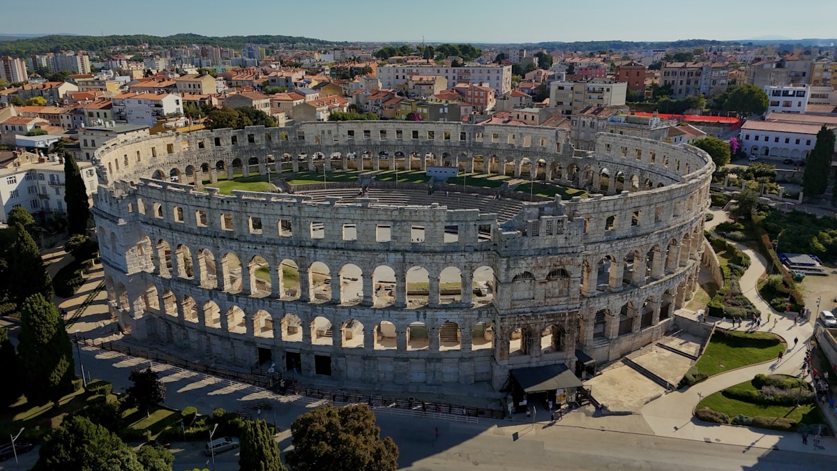Ancient roman amphitheater in a modern city