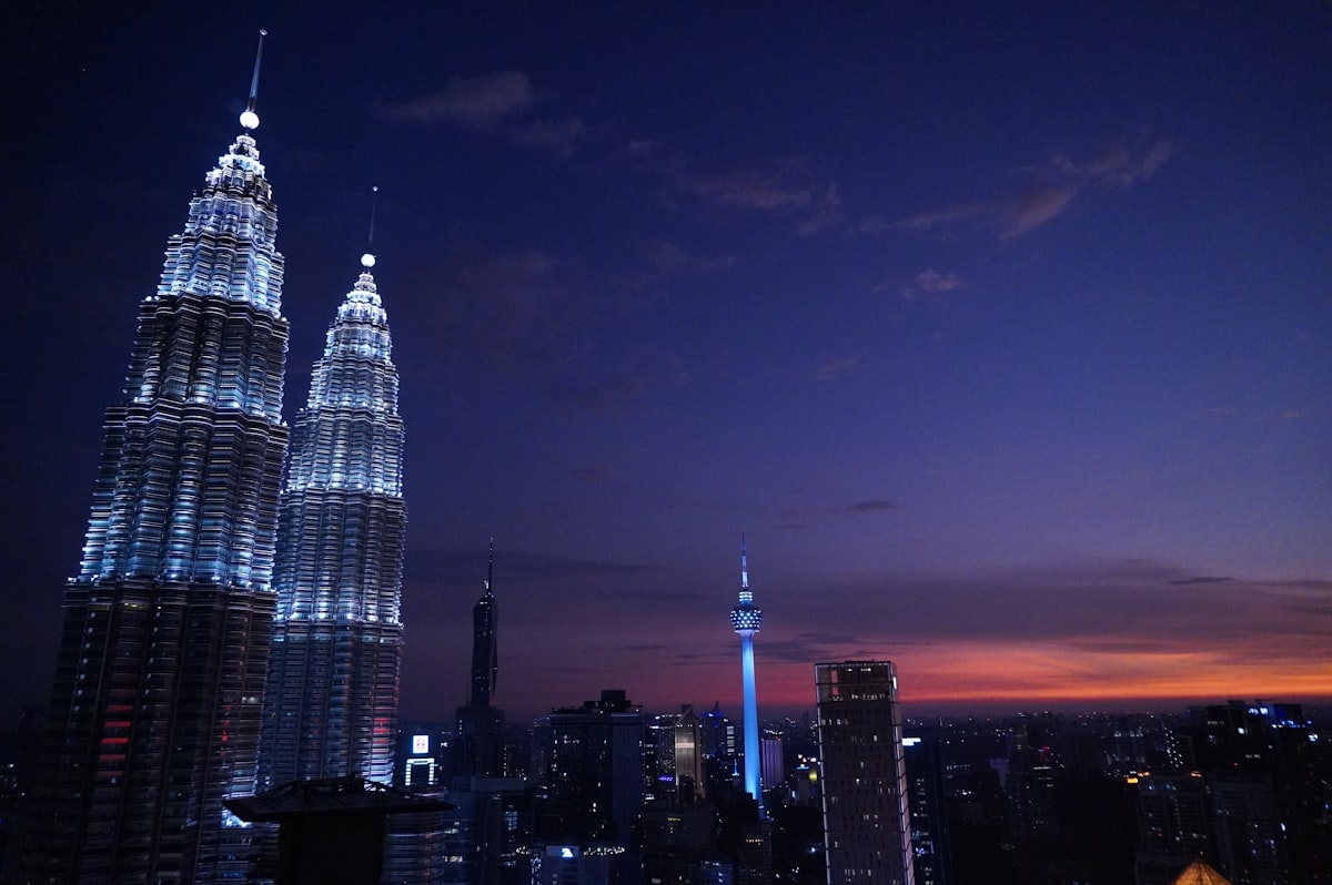 a night view of a city with tall buildings