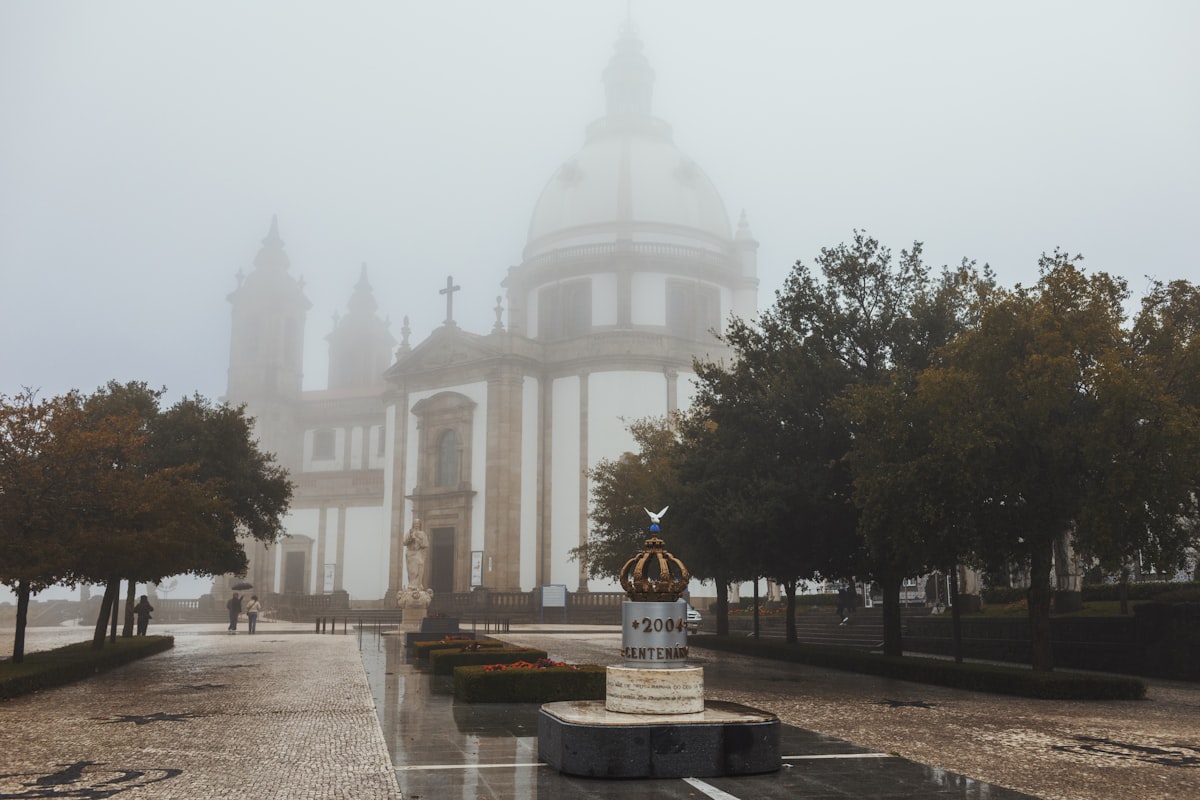 Grand building with dome shrouded in fog