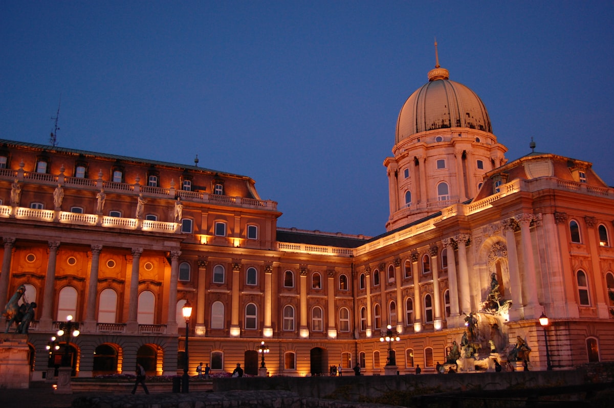 a large building with a clock tower at night