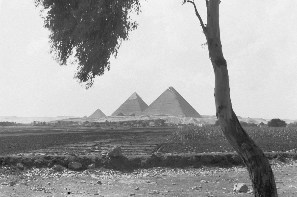 The great pyramids of giza seen from a distance.