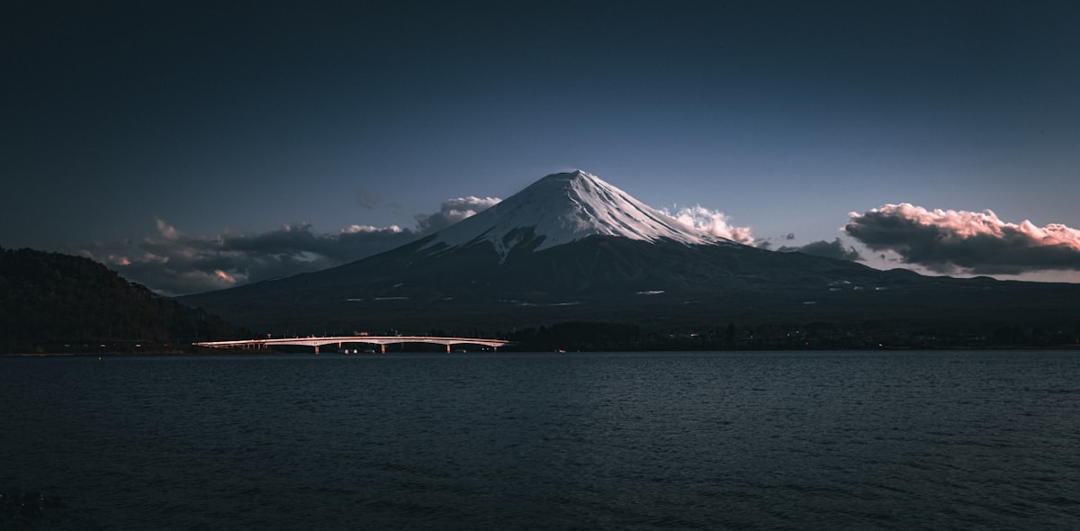 a mountain with a bridge in front of it
