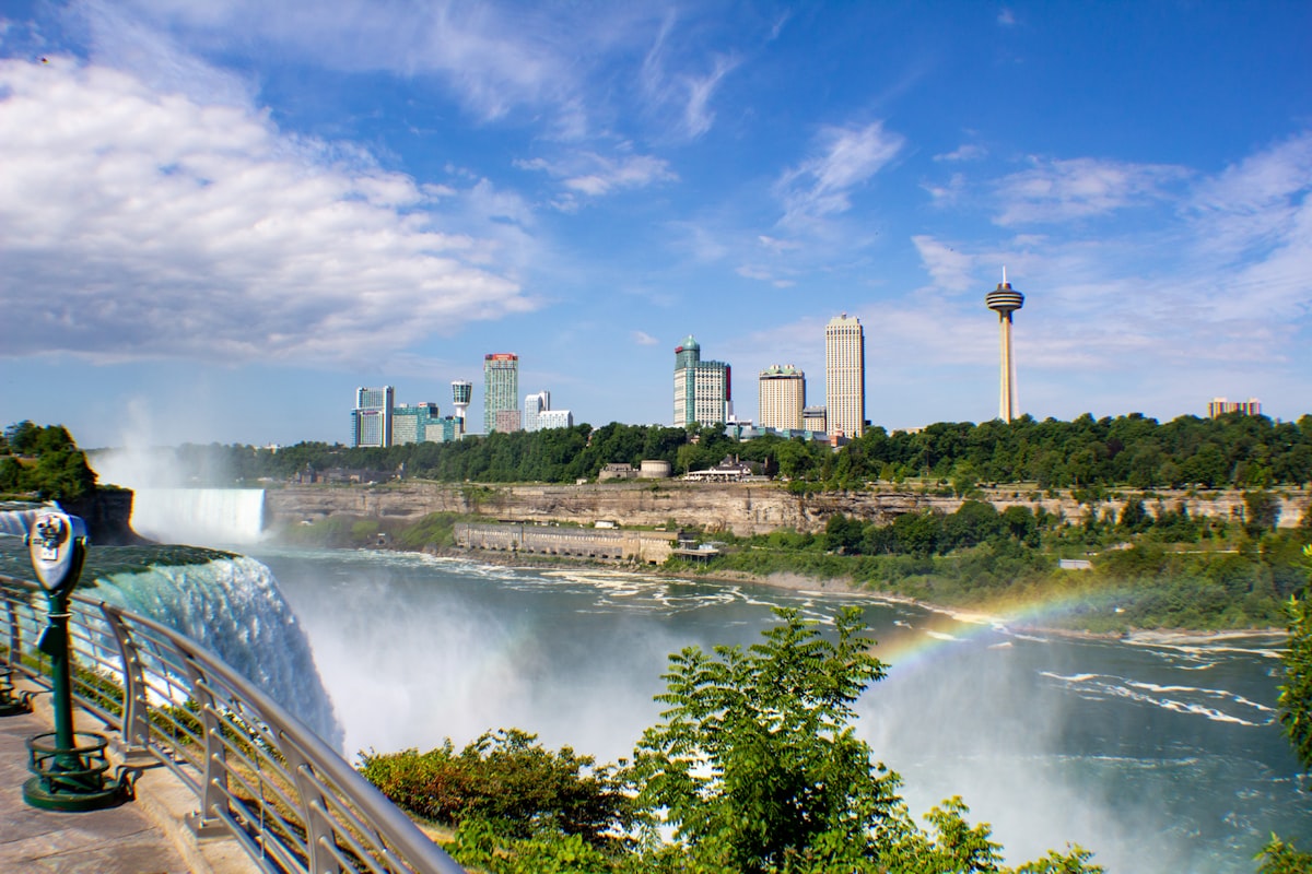 a view of niagara falls with a rainbow in the background