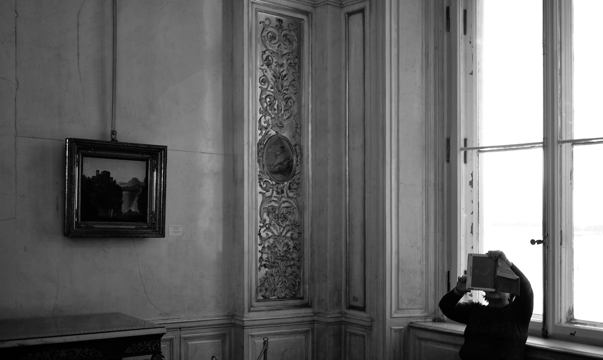 a woman taking a picture of herself in a mirror