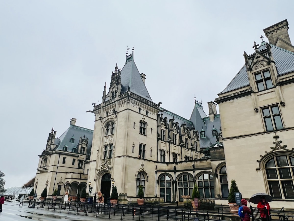 a large building with a black fence