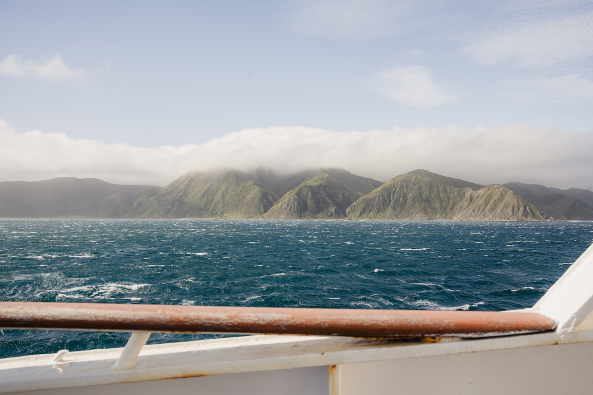 A view of a body of water with mountains in the background