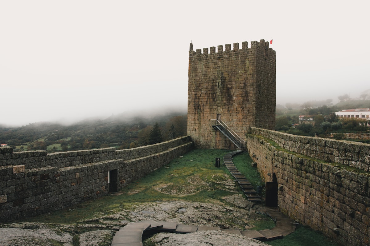 A stone castle with a ramp leading to it