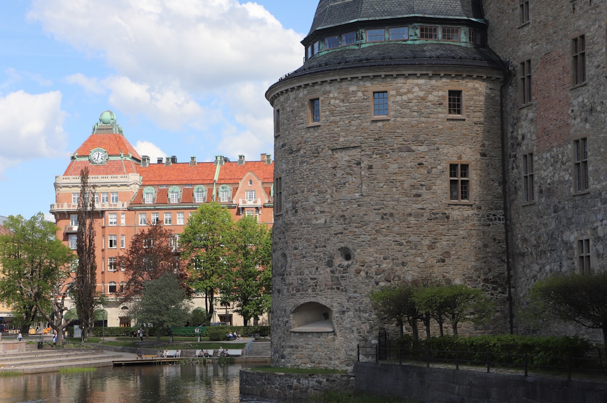 a castle with a pond in front of it