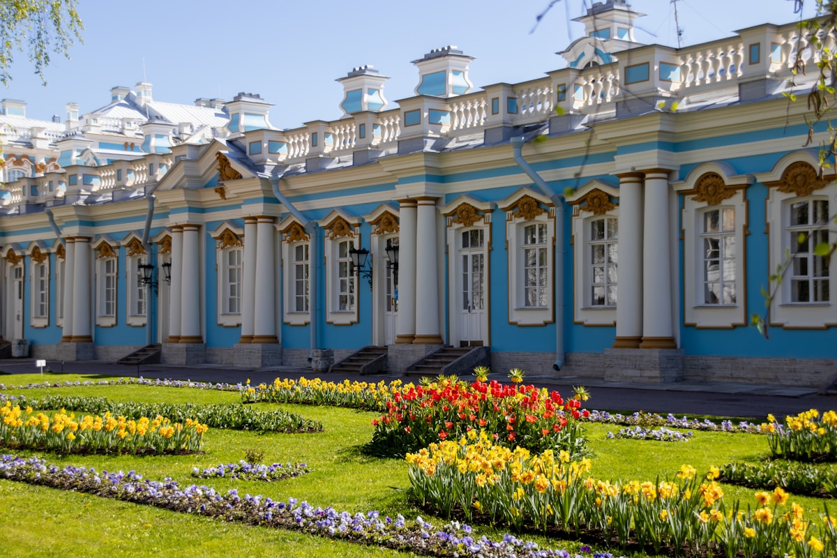 A beautiful palace with a colorful garden.