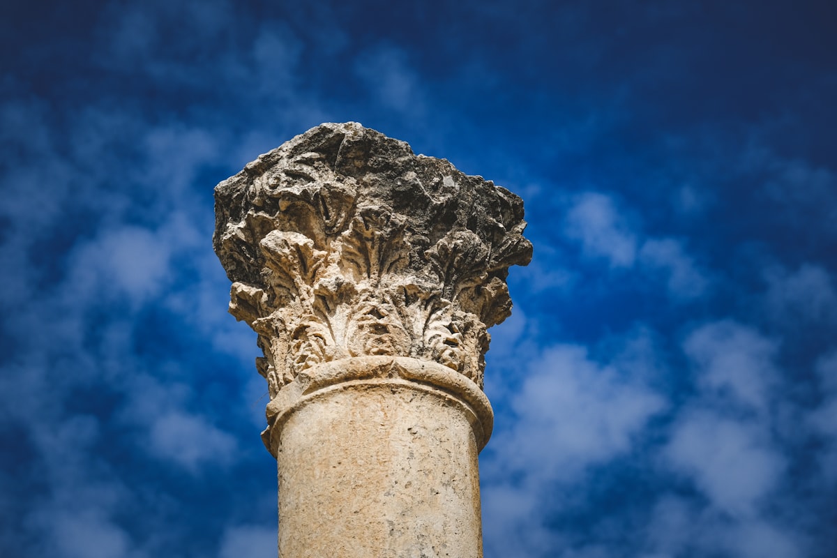a close up of a pillar with a sky background