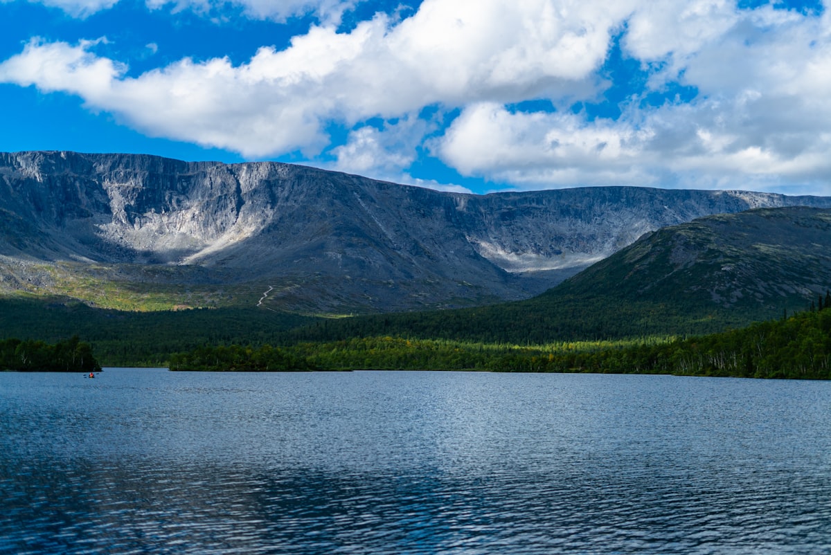 A large body of water surrounded by mountains