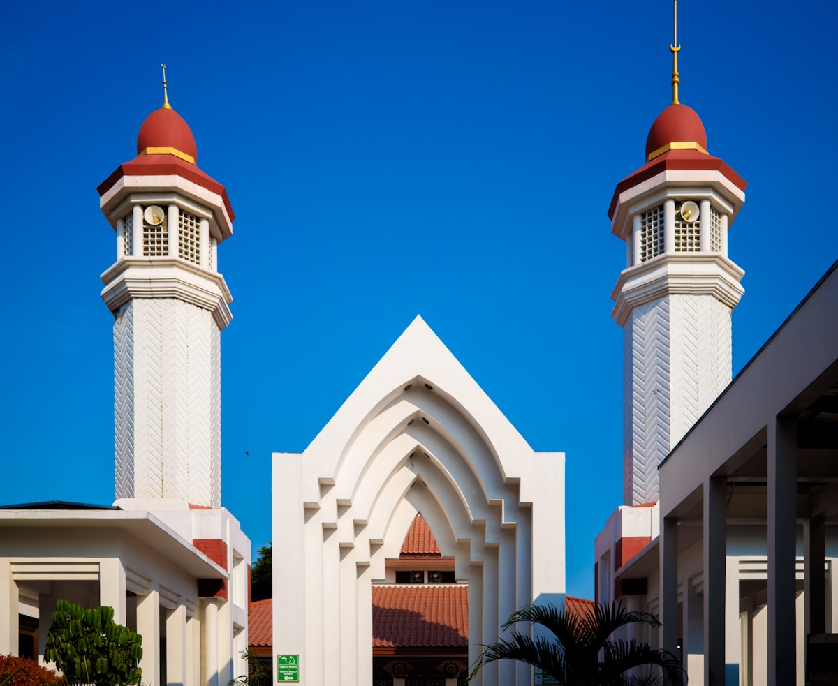A mosque stands with towering minarets.