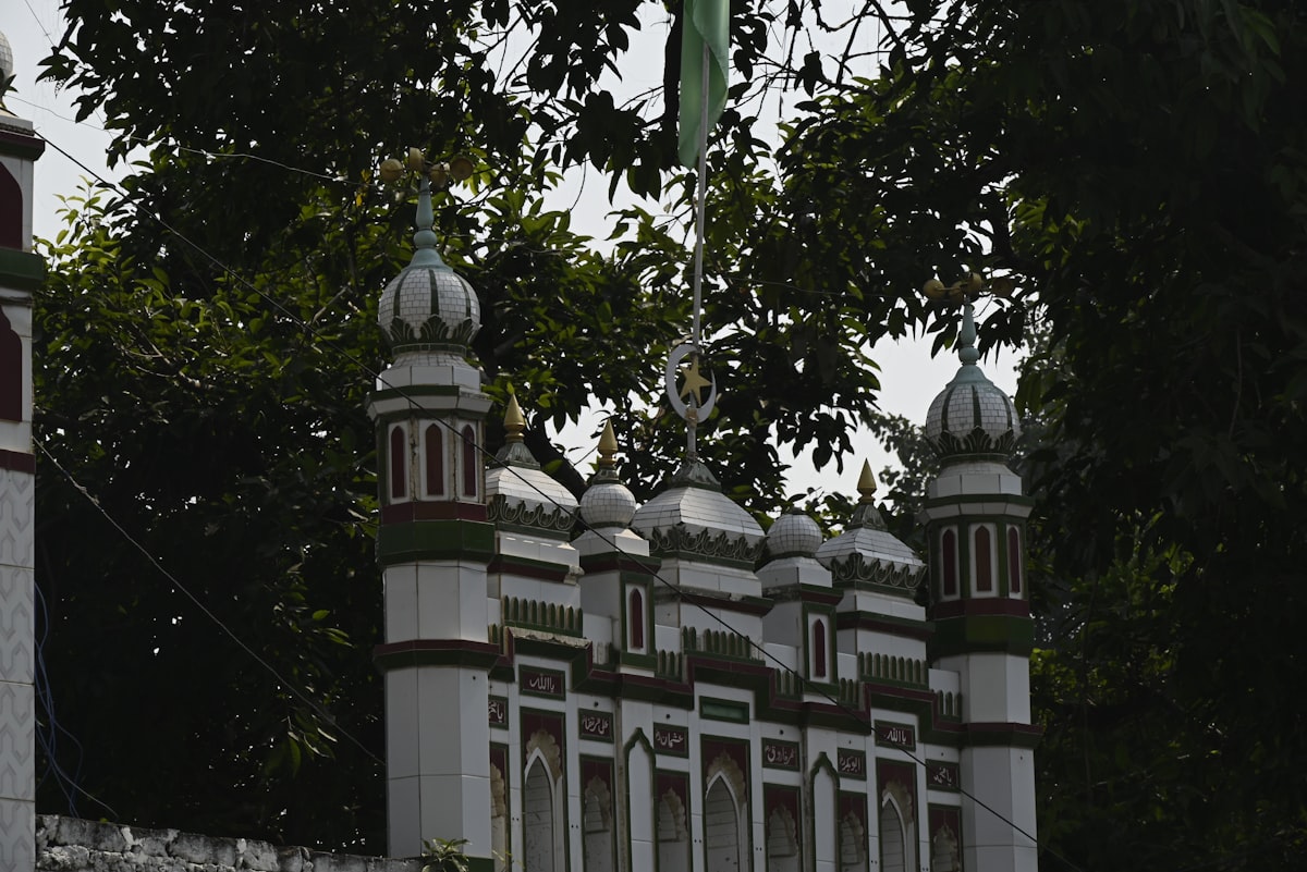 a white and red building with two towers