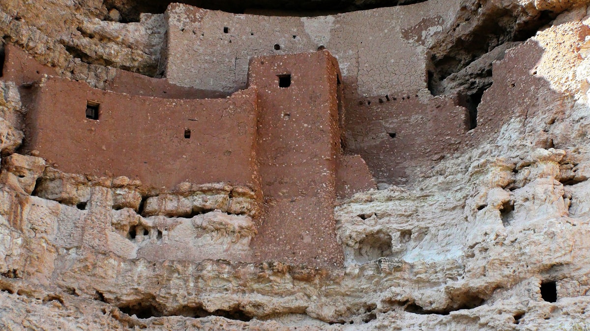 A cliff with a building built into the side of it