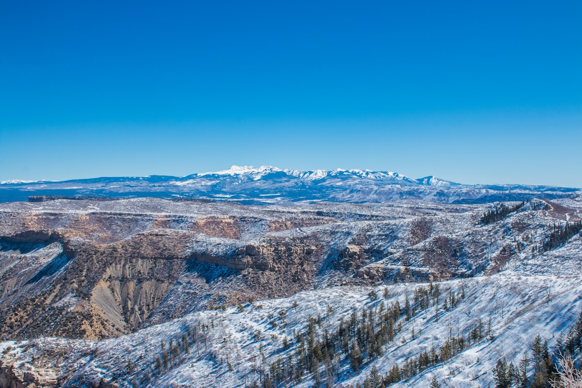 a view of a mountain range covered in snow