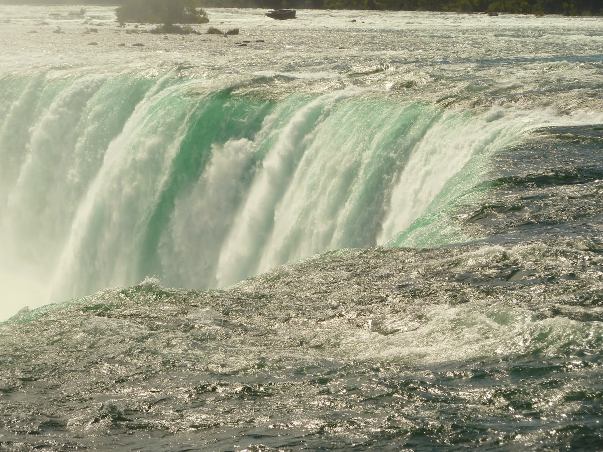 a large waterfall with water pouring out of it